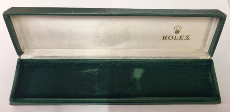 Signed Green Rolex wrist watch retail presentation box with signed white lining and green plush velvet interior, circa 1970s. Box length - 220mm, depth 48mm and height 25mm approximately.