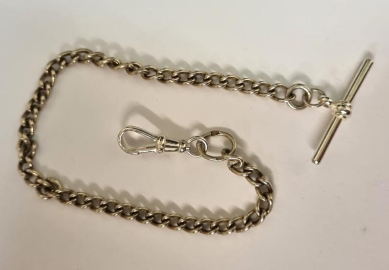 Silver ungraduated watch chain with 'T' bar and snap and indistinct hallmarking.  Length 9", weight 12 grams.