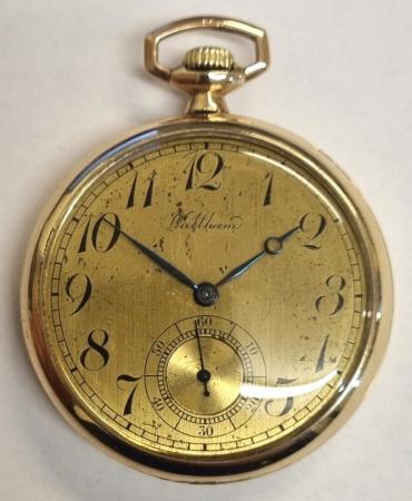 AWW Waltham gold plated dress pocket watch c1920 with top wind and time change. Signed champagne coloured dial with black Arabic hours and blued steel hands with subsidiary seconds dial. Signed American 7 jewel jewelled lever movement numbered 24267401 with breguet style overcoil hairspring and split bi-metallic balance. Screw down bezel and case back with the case back signed and numbered 3609937 and bearing a engraved initials 'GB'.