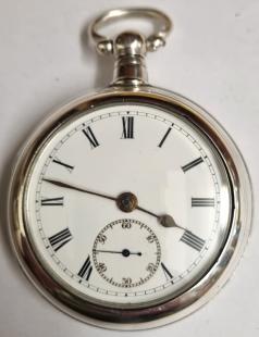 Late English silver pair case key wound lever pocket watch by William Ehrhardt, hallmarked throughout for Birmingham c1919. Domed glass over white enamel dial with black Roman hours and gilt spear and shaft hands with blued subsidiary seconds hand. Plain undecorated back plate numbered #540821 and plain undecorated cock piece with going barrel lever movement.
