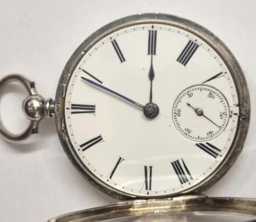 English silver cased unsigned fusee lever pocket watch hallmarked for London c1865. Key wind and time change with white enamel dial and black Roman hours with blued steel hands and subsidiary seconds dial. Plain back plate with engraved cock piece and fusee movement and numbered 1220.